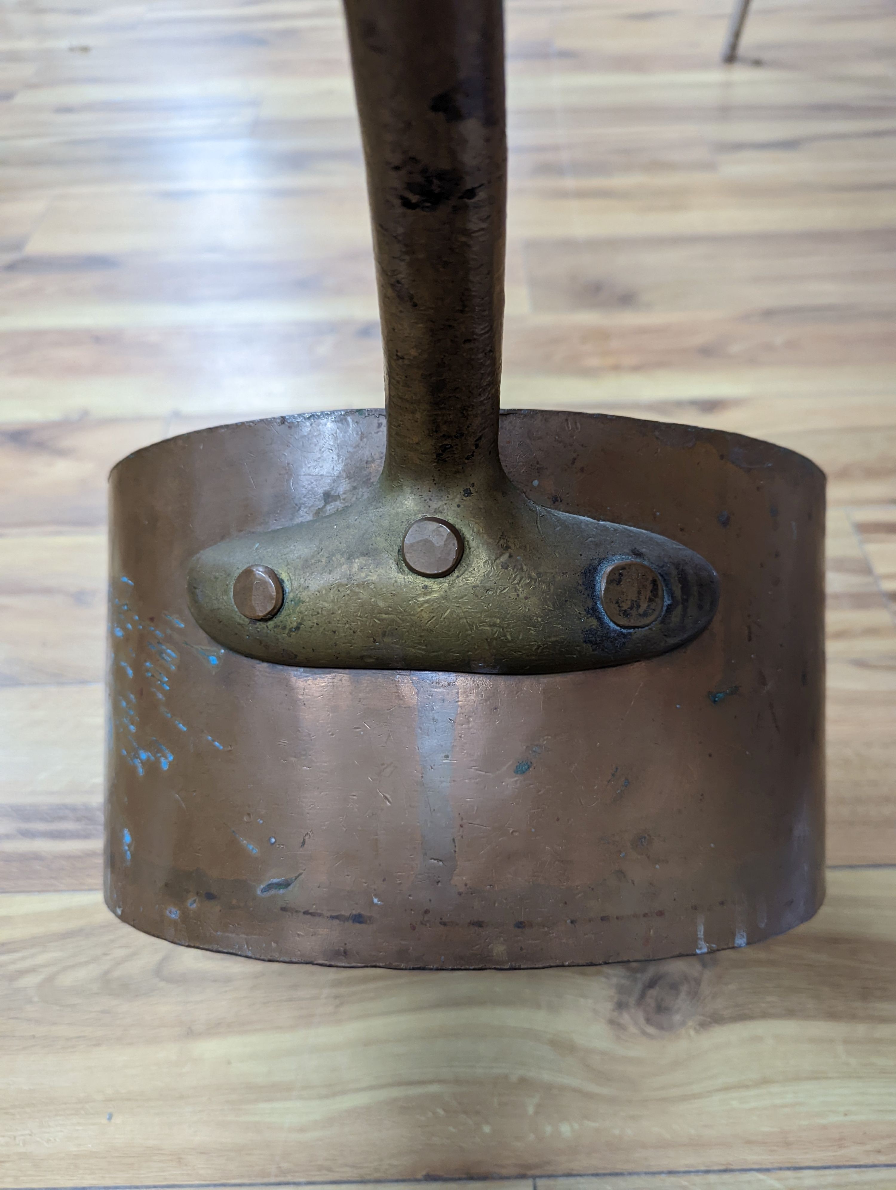 A group of three Jaeggi & Sons copper saucepans